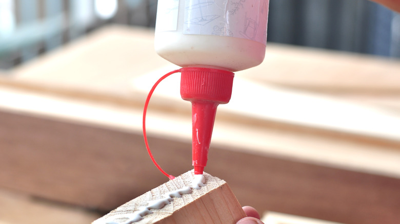 Applying wood glue to boards