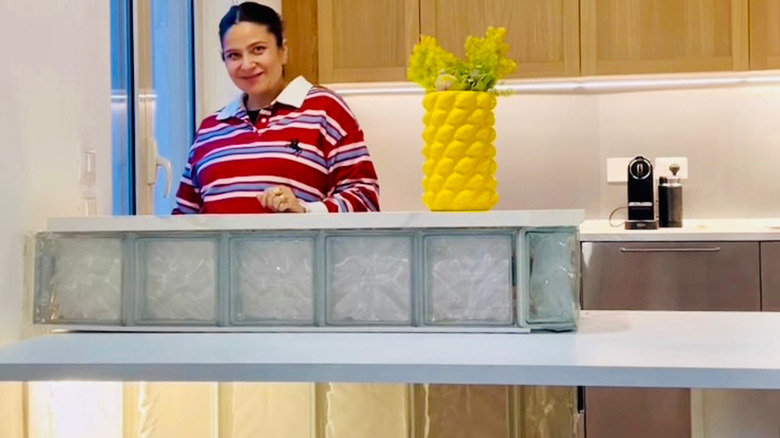 Micol Zanzuri shows off her glass block mini-island with extending table