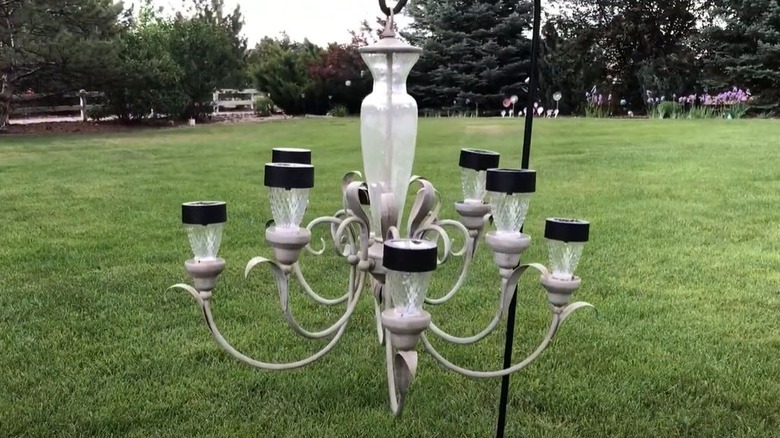 DIY solar light chandelier hanging in backyard