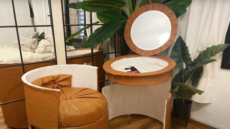 Brown leather vanity with mirror and seat