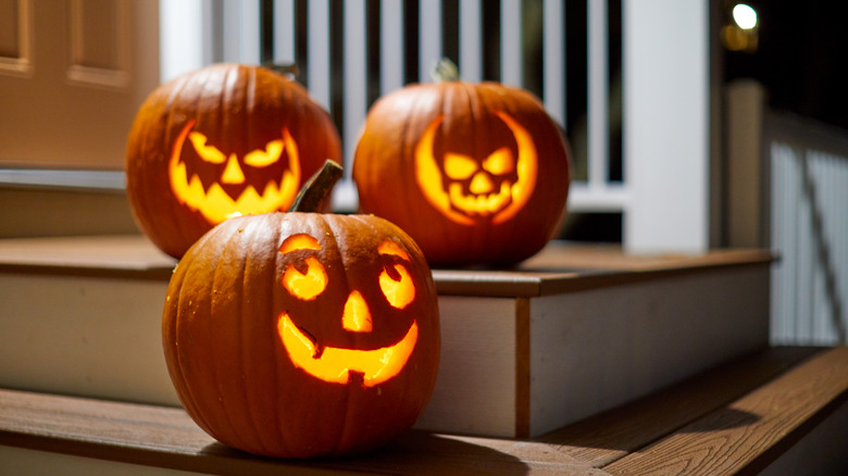 Carved jack-o-lanterns on a porch
