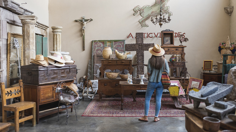 A person shopping through a vintage store