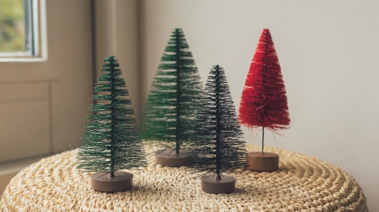 four bottle brush Christmas trees