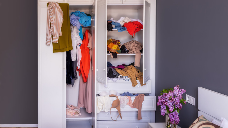 Cluttered white wardrobe