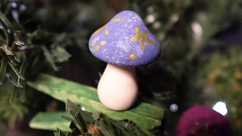 DIY mushroom ornaments pinned to a Christmas tree.