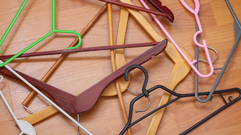 Messy hangers on wooden floor