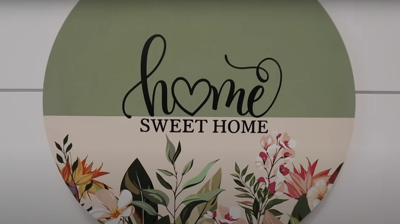 Green and floral home sweet home sign