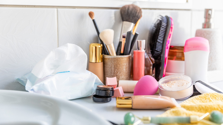 Close up of a disorganized bathroom counter