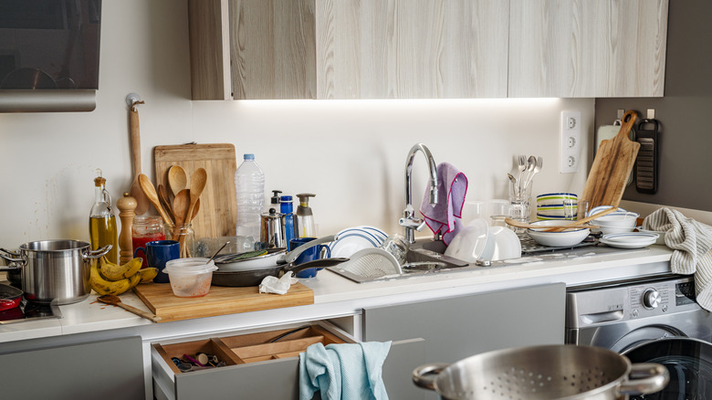 Messy and cluttered kitchen countertop