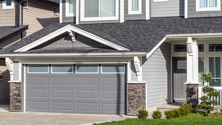 house with garage door and concrete driveway