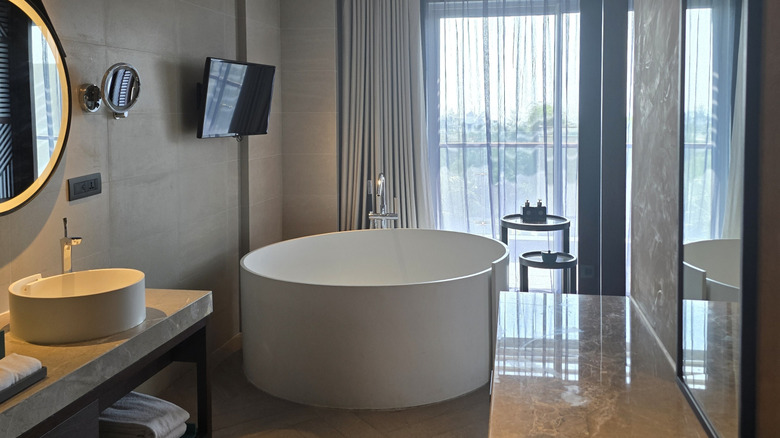 modern bathroom with bathroom above circular tub