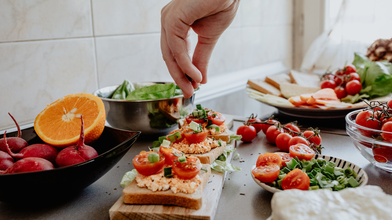 Adding seasoning to dish