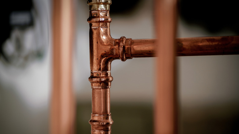 Exposed copper bathroom pipes.