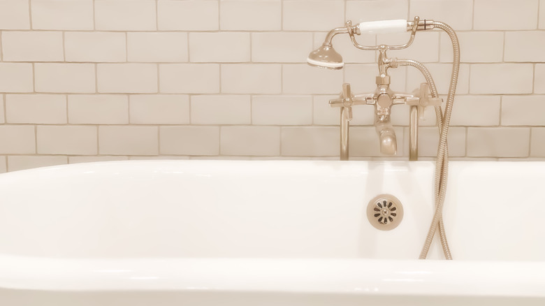 A freestanding tub and vintage hardware.
