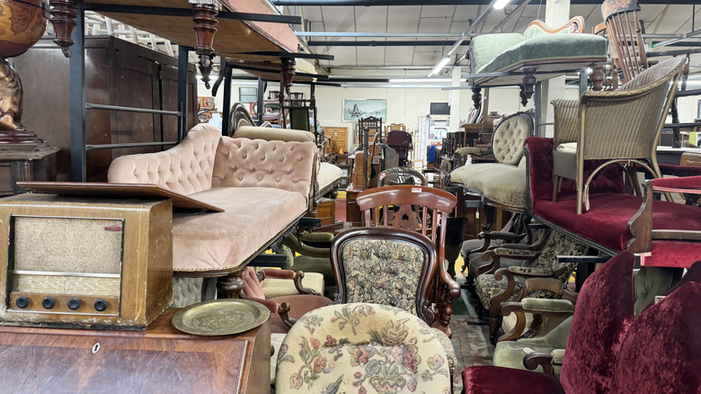 Upholstered furniture pieces in a thrift store