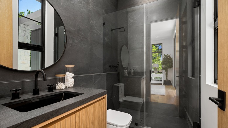 A bathroom with frameless glass shower doors.