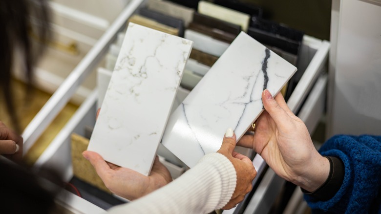 hands holding countertop samples