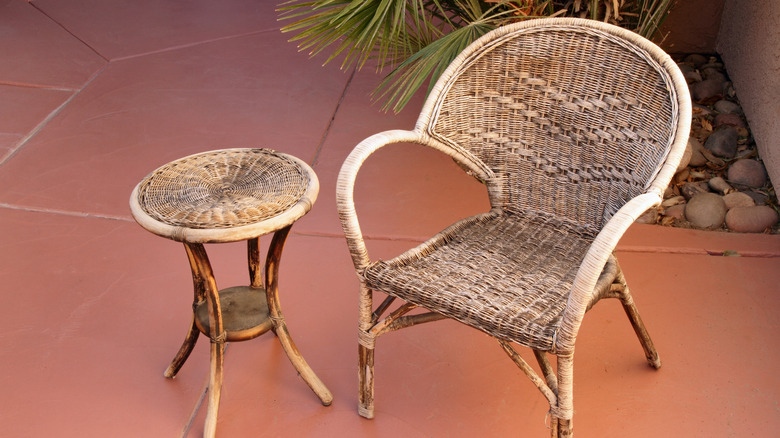 An old wicker chair and table