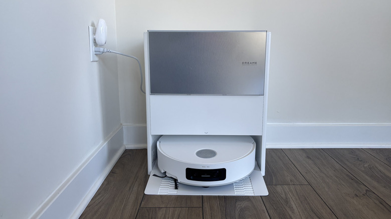 Dreame Aqua10 Ultra Roller set up in dock and plugged in to outlet
