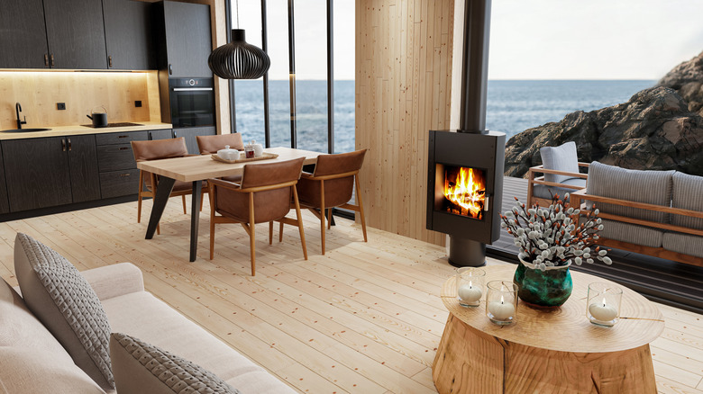 Scandinavian style open plan home with wooden floor and log burner