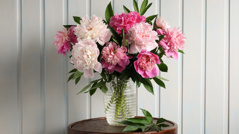 Glass vase full of pink flowers