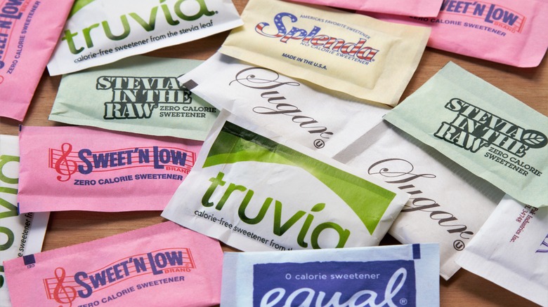 a variety of artificial sweeteners on a desk