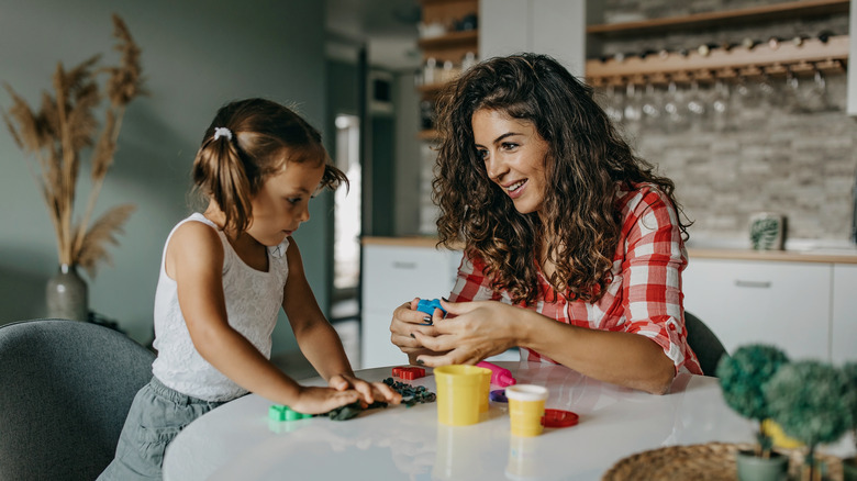 Mother and daughter working with Play-Doh