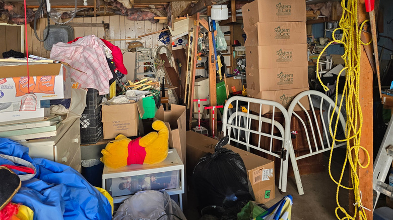 Cluttered garage with lots of boxes