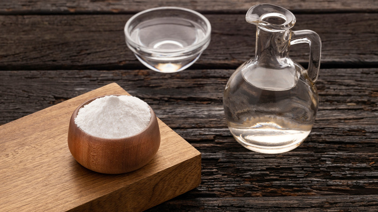 baking soda and vinegar on a wood table