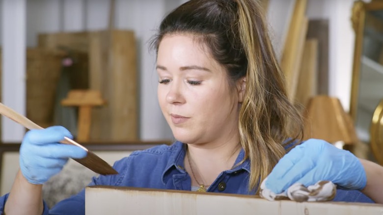 Jenni Yolo staining some wood