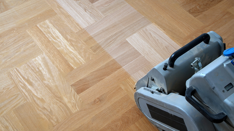 sander on wood floor