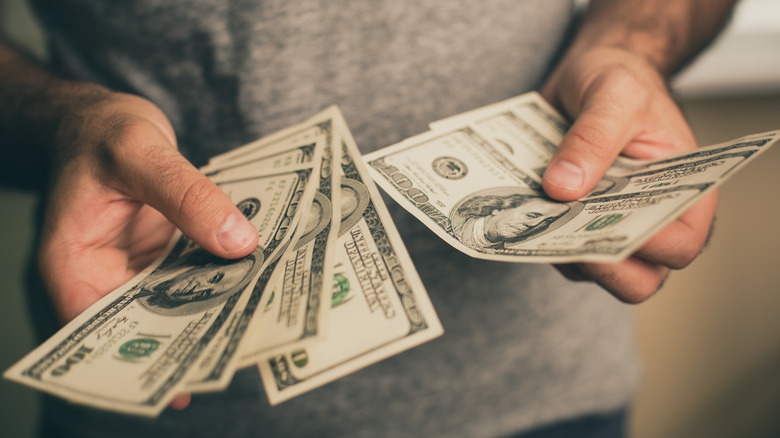Person counting money