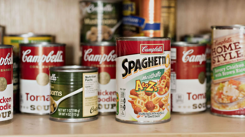 cans of soup in cupboard 