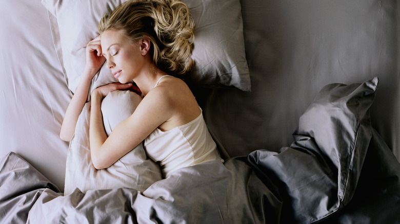 Woman sleeping in bed