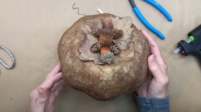 A completed DIY rustic pumpkin made from a balloon.