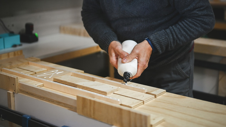 man using wood glue