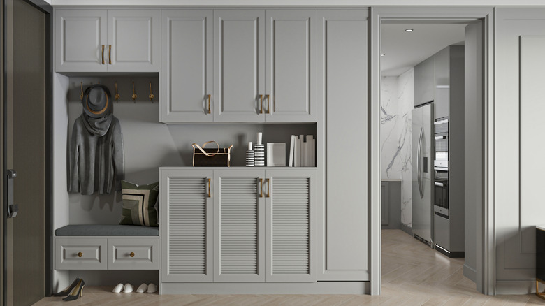 Modern Gray Entryway with Built-in Storage and Kitchen View