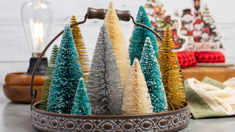 Festive bottle brush trees with Christmas decor