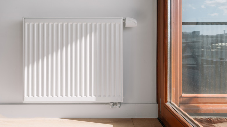 A radiator next to a window in a living room