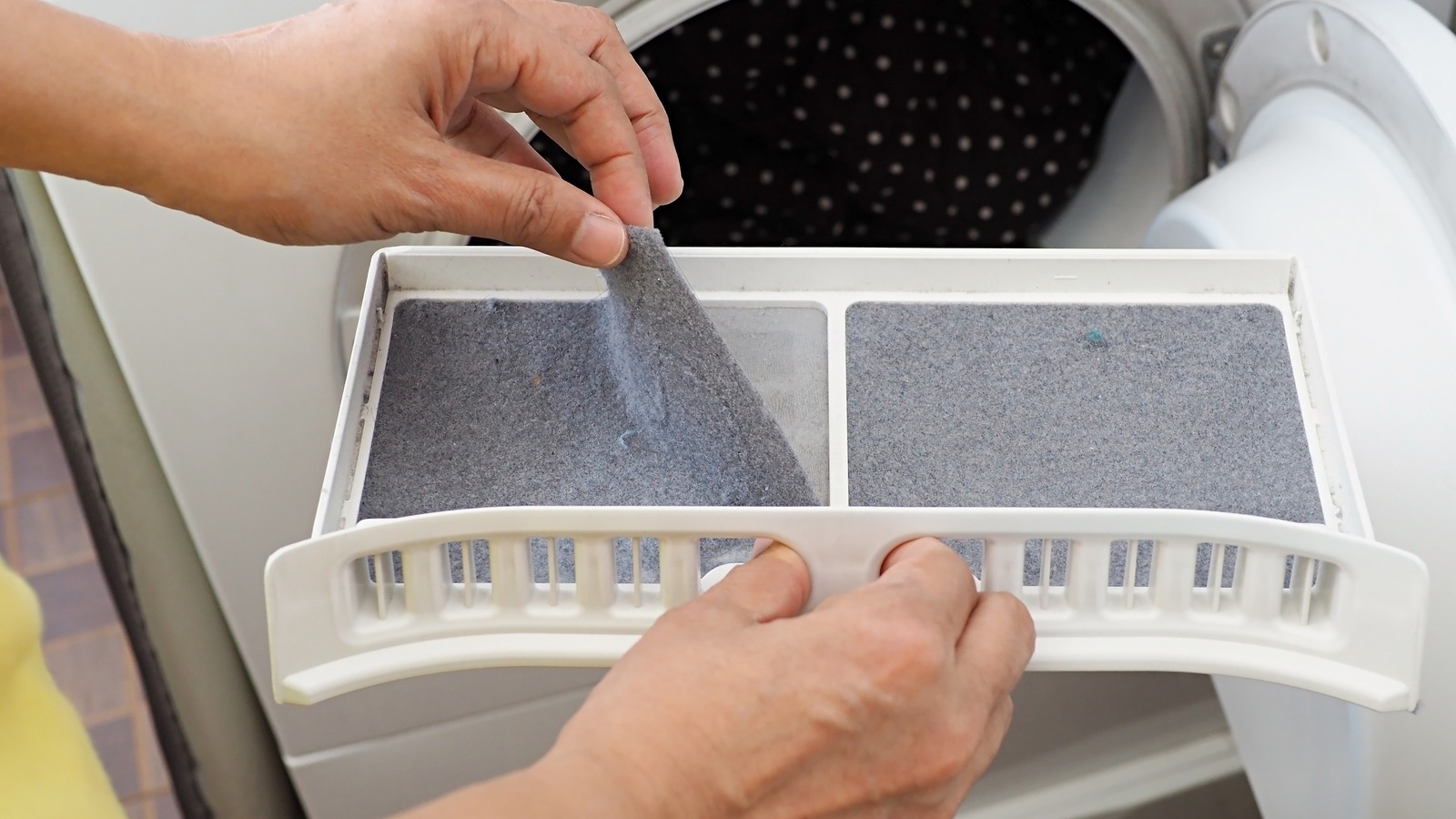 The Easy Pillowcase Hack That Makes Cleaning Your Dirty Lint Trap A Breeze
