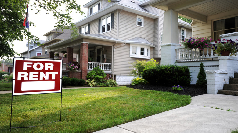 Outside of a house with a For Rent sign