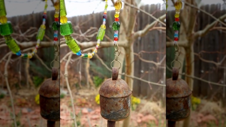 Beaded bell chain hanging in tree