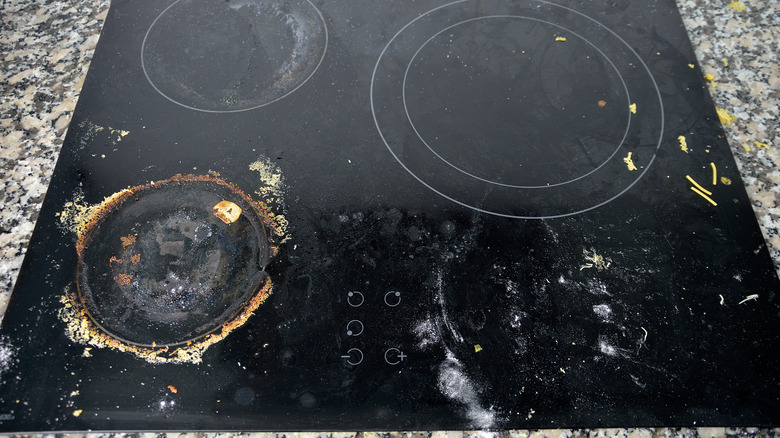 Dirty cooktop stove with crusty dried food