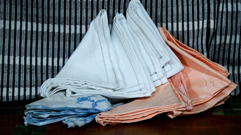 Stack of embroidered table linens