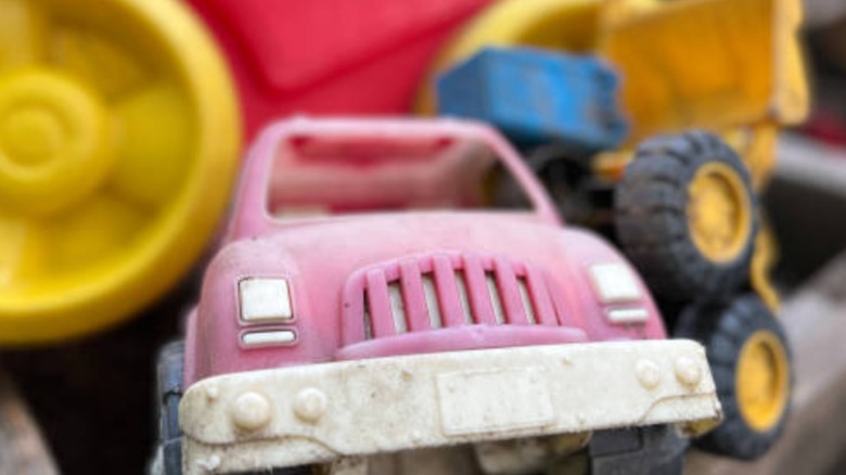 A pile of dirty car toys.