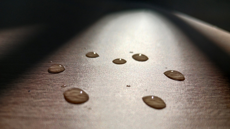 A few water droplets on a wood surface