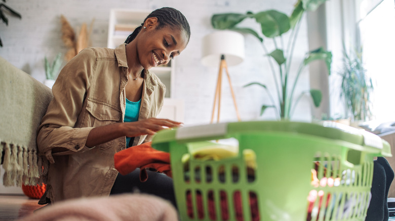 Woman sorting laundry before a wash