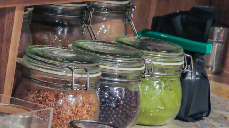 Glass spice jars in a pantry