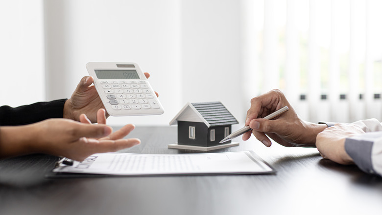 Two people discussing a home purchase