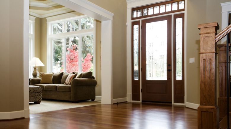 Large front door entryway with wooden flooring